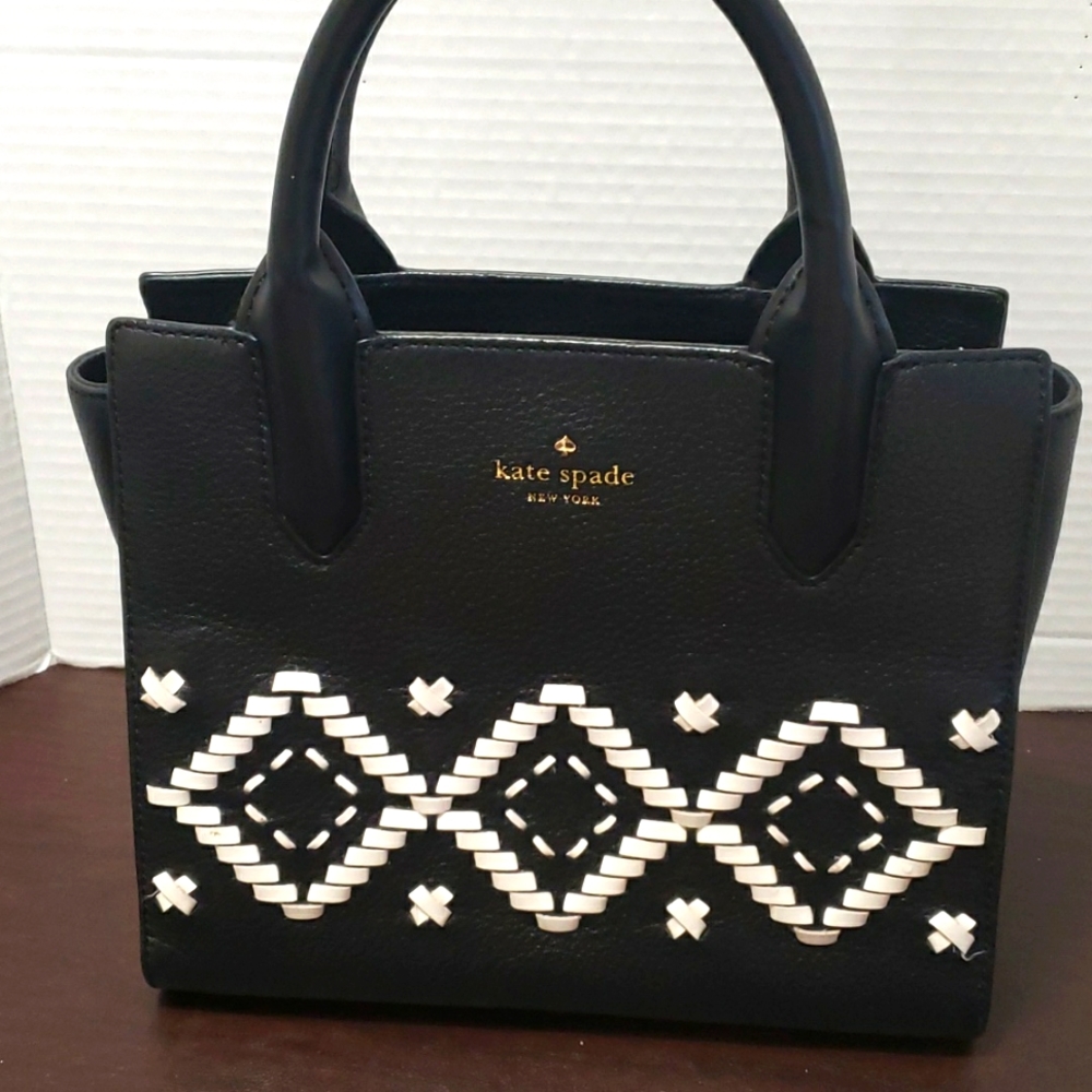 Like new Kate Spade black leather purse w white stitching. 10 " across.